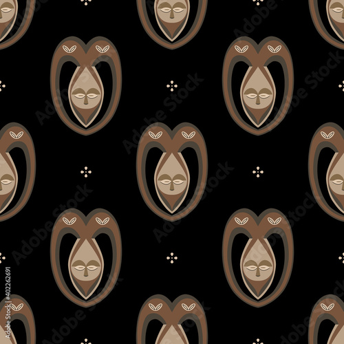 Seamless ethnic pattern with African masks. photo