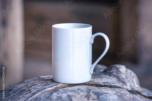 White porcelain coffee cup, mug on old wooden table