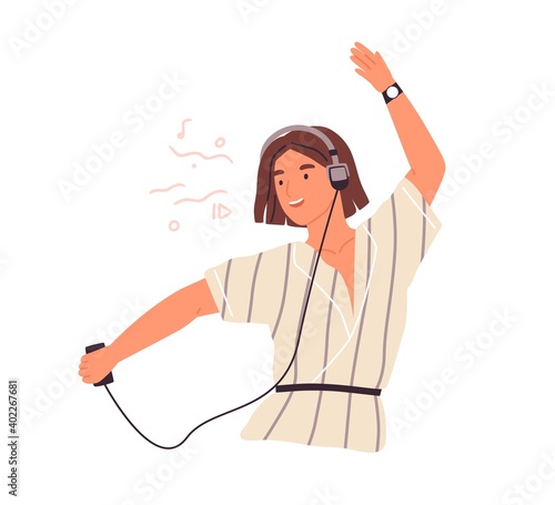Cute female teenager listening to music in headphones and dancing vector flat illustration. Happy young woman enjoying audio sound using smartphone or mp3 player isolated on white background