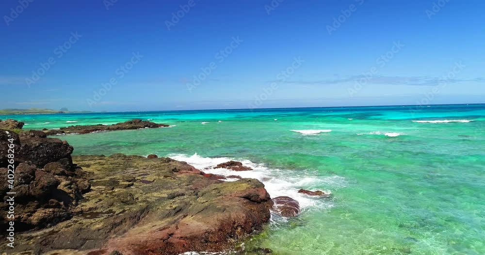 Tropical Ocean Waves Over Rocks