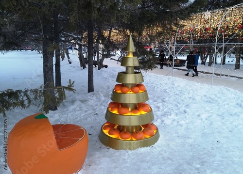 beautiful artificial tree with oranges