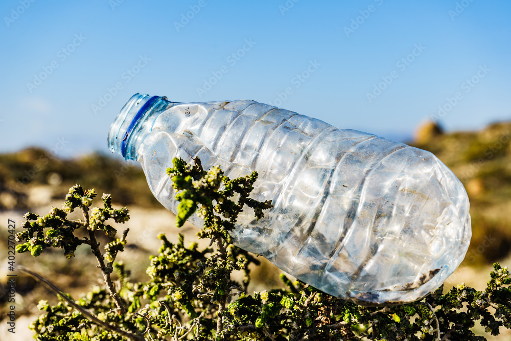 Plastic empty water bottle abandoned on nature Plastic empty water bottle abandoned on nature
