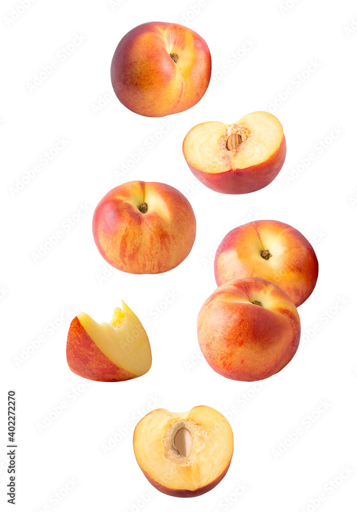 Falling sliced peach fruit isolated on white Falling sliced peach fruit isolated on white