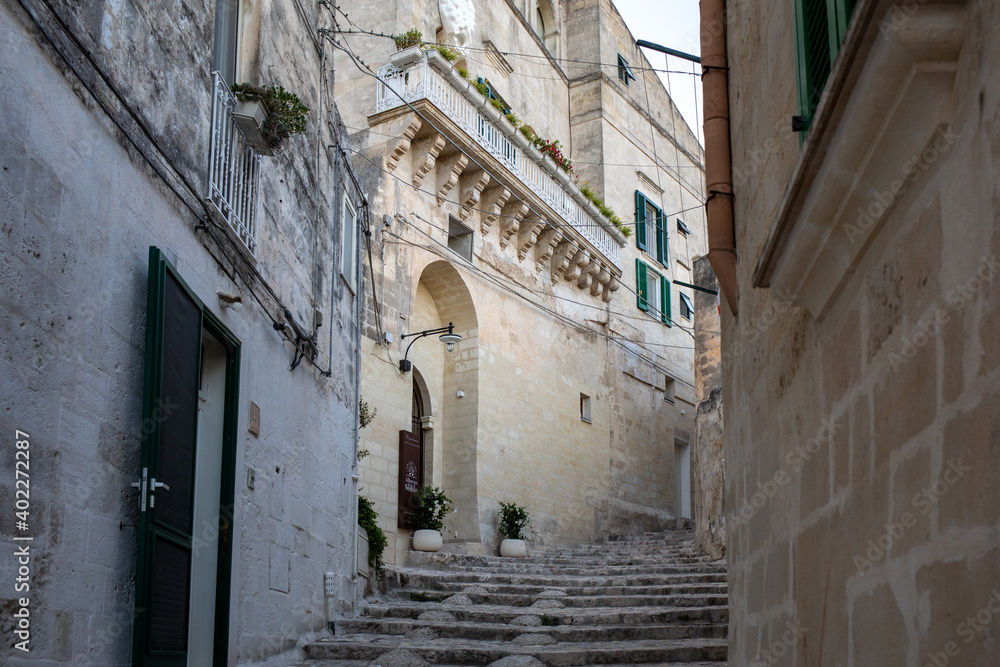  Cobblestone street in the Sassi di Matera a historic district in the city of Matera. Basilicata. Italy