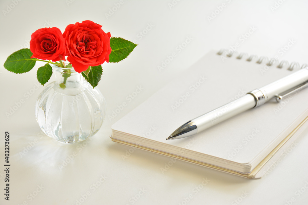 Red rose and a notebook Red rose and a notebook