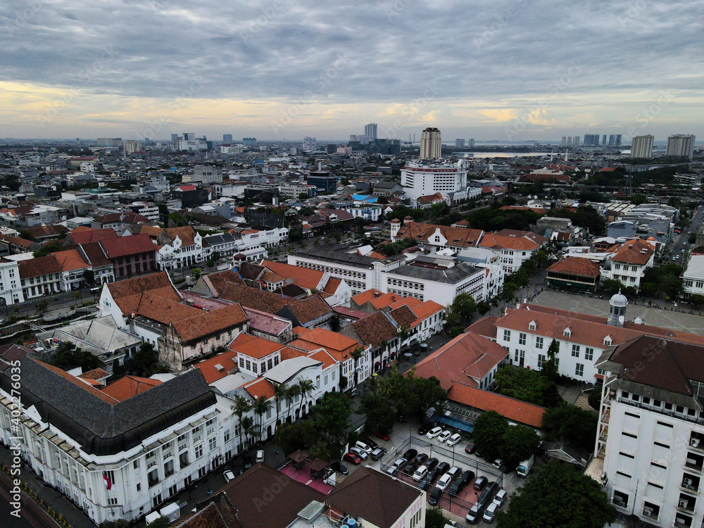 Aerial View. Fatahilah museum at Old City at Jakarta, Indonesia. With Jakarta cityscape and noise cloud when sunset. 