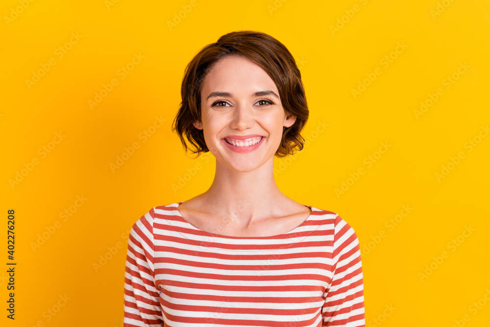 Close up photo of satisfied young person great smile looking you isolated on bright yellow color background Close up photo of satisfied young person great smile looking you isolated on bright yellow color background