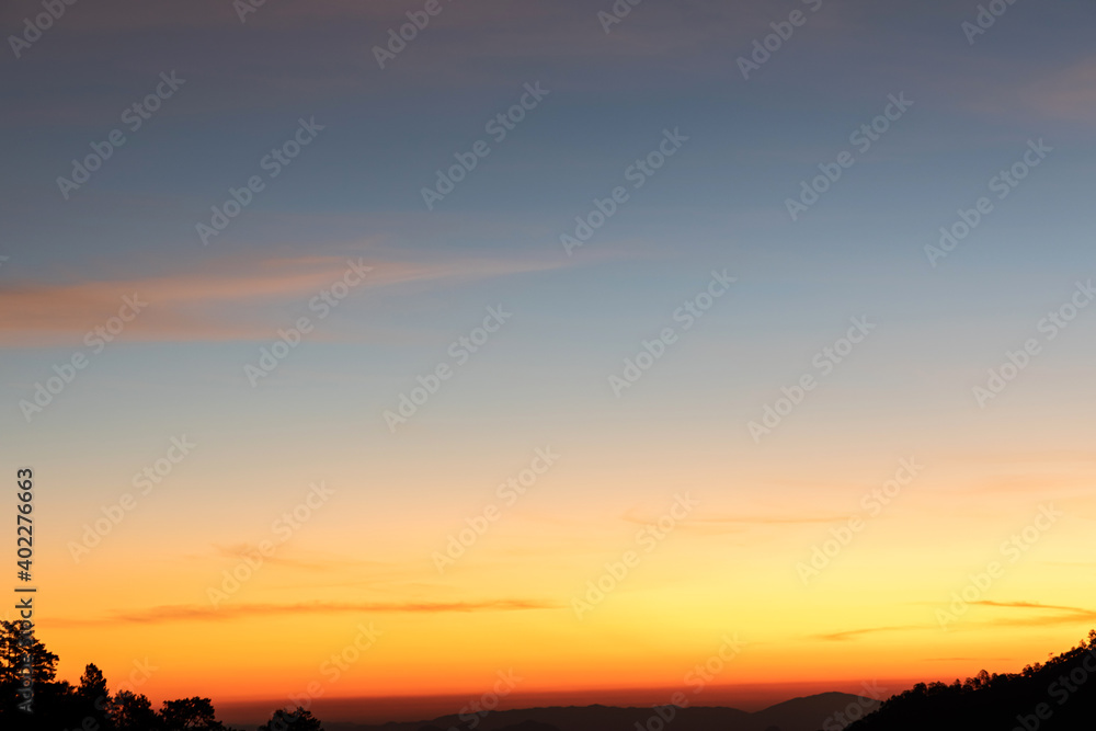 Heaven at early morning with copy space. Sunset, sunrise backdrop.Predawn clear sky with orange horizon and blue atmosphere. Smooth orange blue gradient of dawn sky. Heaven at early morning with copy space. Sunset, sunrise backdrop.Predawn clear sky with orange horizon and blue atmosphere. Smooth orange blue gradient of dawn sky.