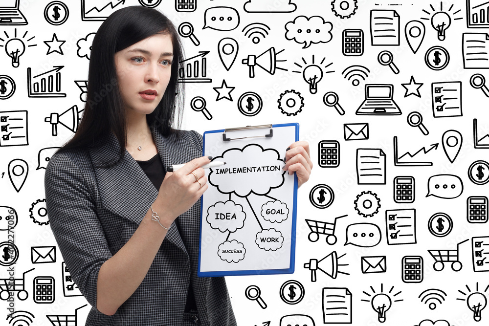 Business, technology, internet and network concept. Young businessman thinks over the steps for successful growth: Implementation Business, technology, internet and network concept. Young businessman thinks over the steps for successful growth: Implementation