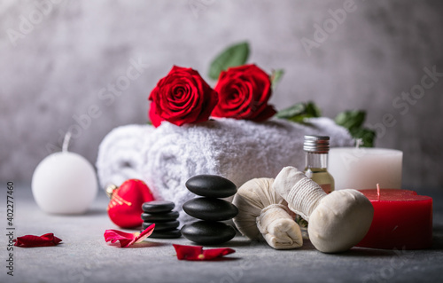 Wellness decoration, spa massage setting, oil on stone background. Valentine's Day Zen and relax concept.