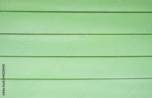 Horizontal Bright green wooden wall. green wood texture background.