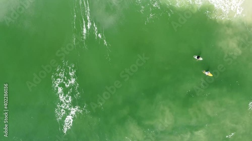 surfers vertical view from drone