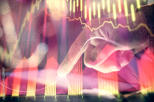 Multi exposure of man's hands holding and using a phone and financial chart drawing. Market analysis concept.