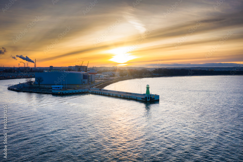 The lighthouse at the exit to the Baltic Sea in New Port at sunset, Gdansk. Poland