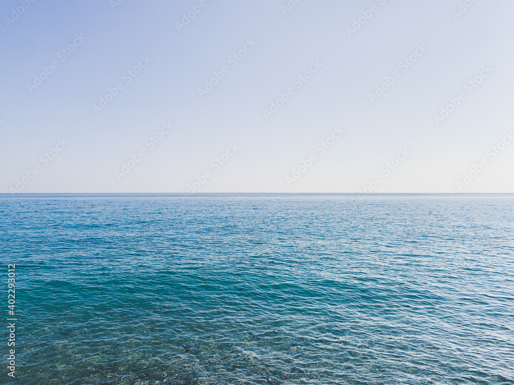 Obraz premium Blue sea and clear blue sky background