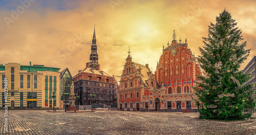 Town Hall square with House of the Blackheads and Christmas tree during sunset in winter, old town Riga, Latvia