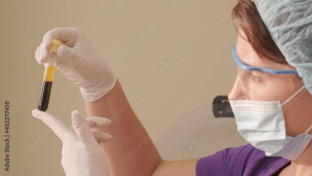 Platelet-Rich plasma preparation. Tube with blood in hands. Platelet-Rich plasma preparation. Tube with blood in hands.