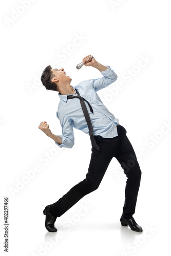 Singer. Happy young man dancing in casual clothes or suit, remaking legendary moves and dances of celebrity from culture history. Isolated on white. Action, motion, fame concept. Creative occupation.