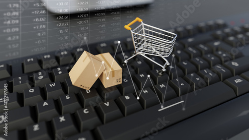 Shopping online. Cardboard box and a shopping cart on a keyboard. Shopping service on the online web. Offers home delivery.