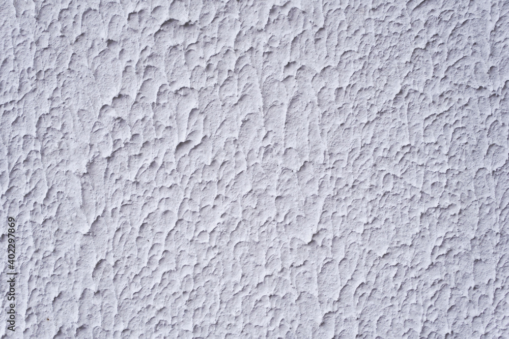 Structure of textured white decorative plaster as background. Structure of textured white decorative plaster as background.