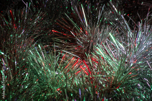 Christmas tinsel made of foil with green and red reflections