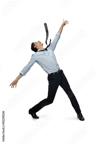 Celebrity. Happy young man dancing in casual clothes or suit, remaking legendary moves and dances of celebrity from culture history. Isolated on white. Action, motion, fame concept. Creative