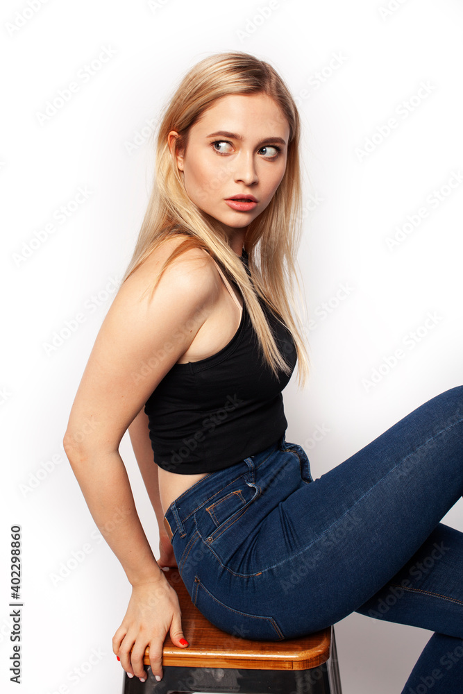 young blond woman on white backgroung gesture thumbs up, isolated emotional posing young blond woman on white backgroung gesture thumbs up, isolated emotional posing