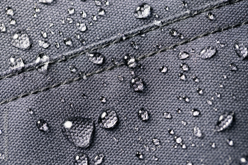 Принти на полотні waterproof fabric - closeup of water resistant textile with water drops