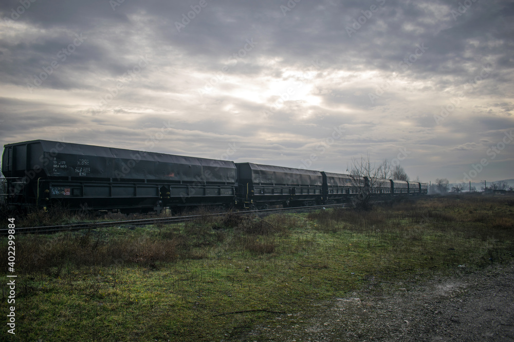 Train carriages carrying various goods. Industrial area Train carriages carrying various goods. Industrial area