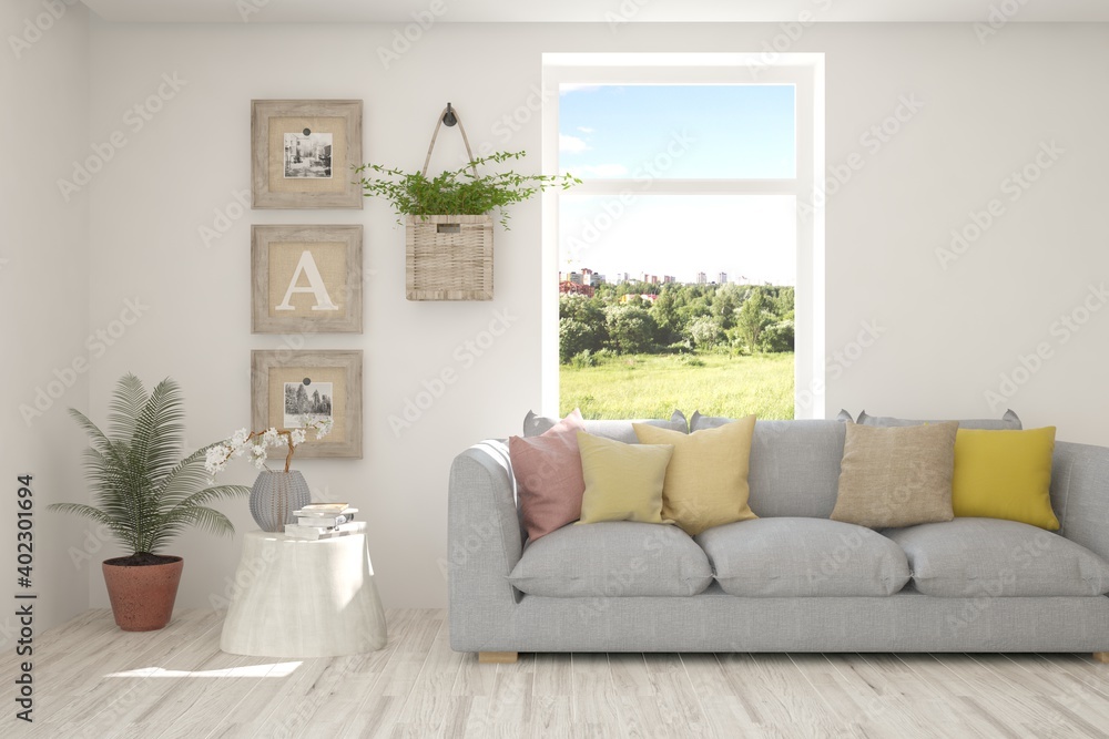 Fototapeta premium White living room with sofa and summer landscape in window. Scandinavian interior design. 3D illustration