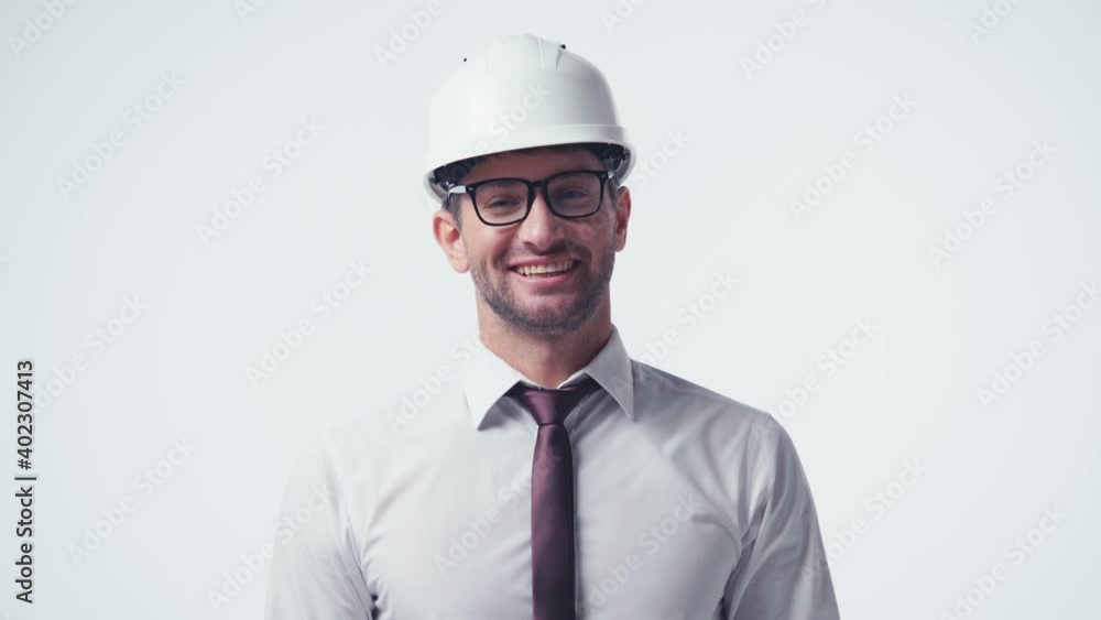 happy architect in hardhat and glasses greeting isolated on white happy architect in hardhat and glasses greeting isolated on white