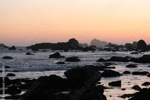 California sunrise with rock silhouette 