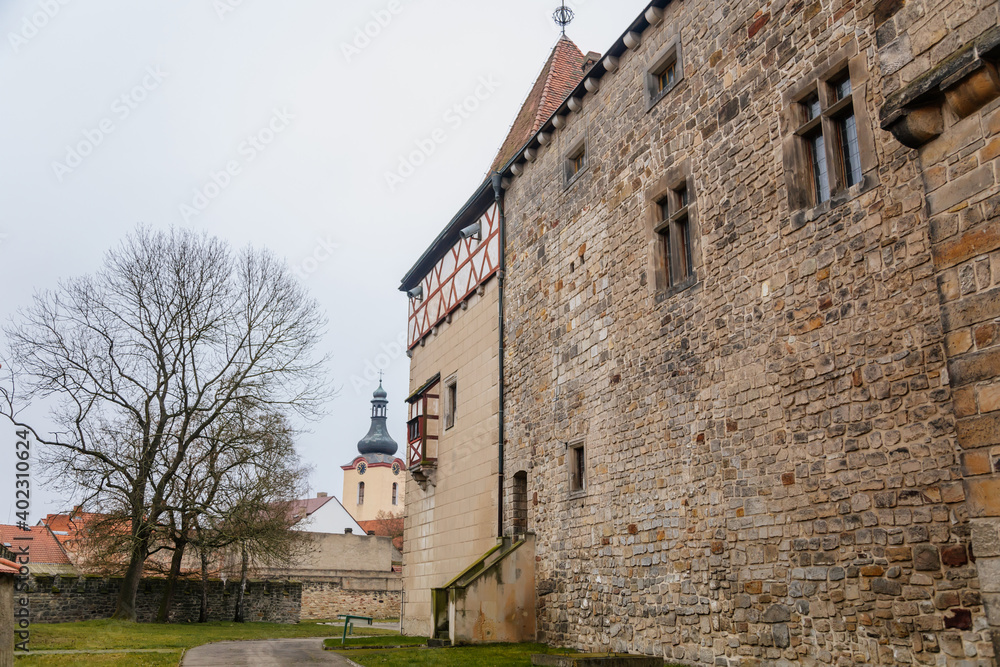 Fortified medieval stronghold, Moated gothic castle at romantic style, National cultural landmark in winter day, Budyne nad Ohri, Northwest Bohemia, Czech Republic