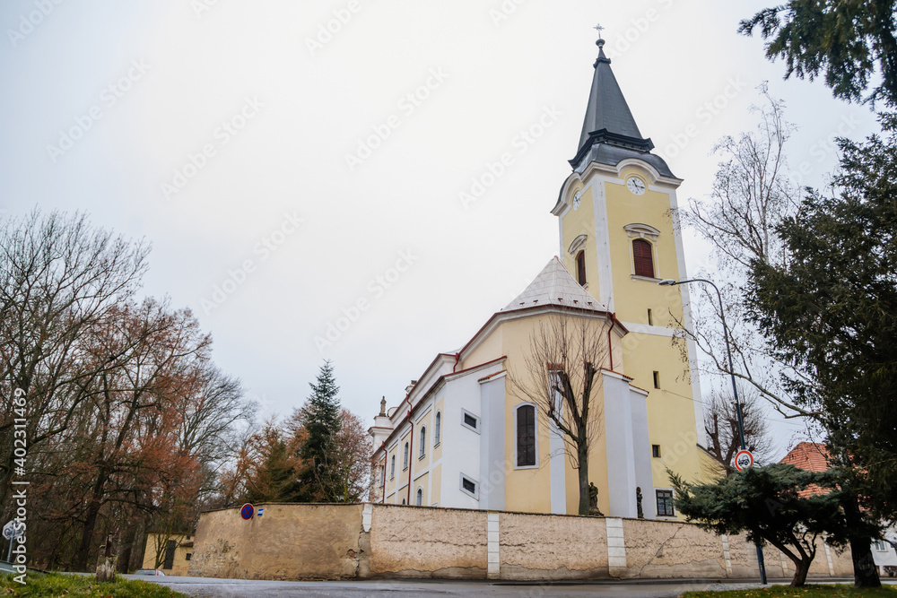 Baroque Church of All Saints in winter day, Chapel near castle, Libochovice, Litomerice district, Bohemia, Czech Republic