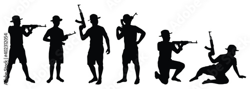 Set of young boy soldier with weapon silhouette vector