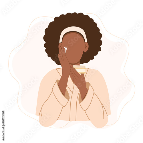 Skin care routine. Black woman in bathrobe applying cream on her face. Cute cartoon hand drawn vector illustration in flat style isolated on white.