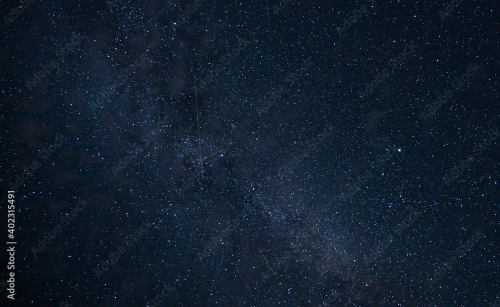 Fototapeta premium Colorful shot of the milky way with small clouds. Astrophotography