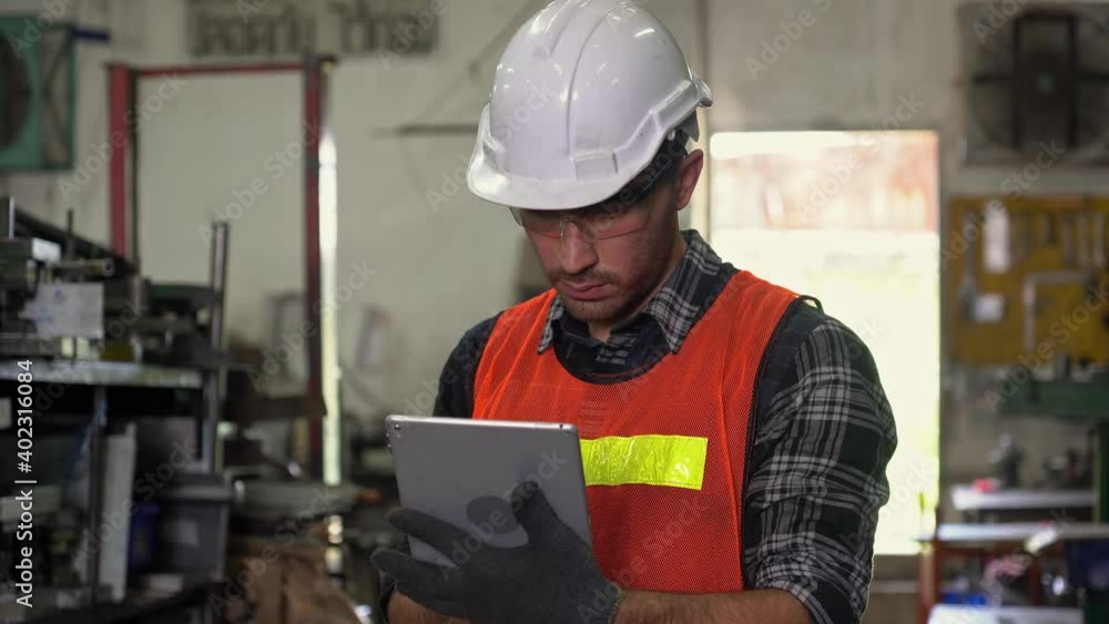 Engineers inspect or repair industrial machines with tablets in industrial plants. Engineers inspect or repair industrial machines with tablets in industrial plants.