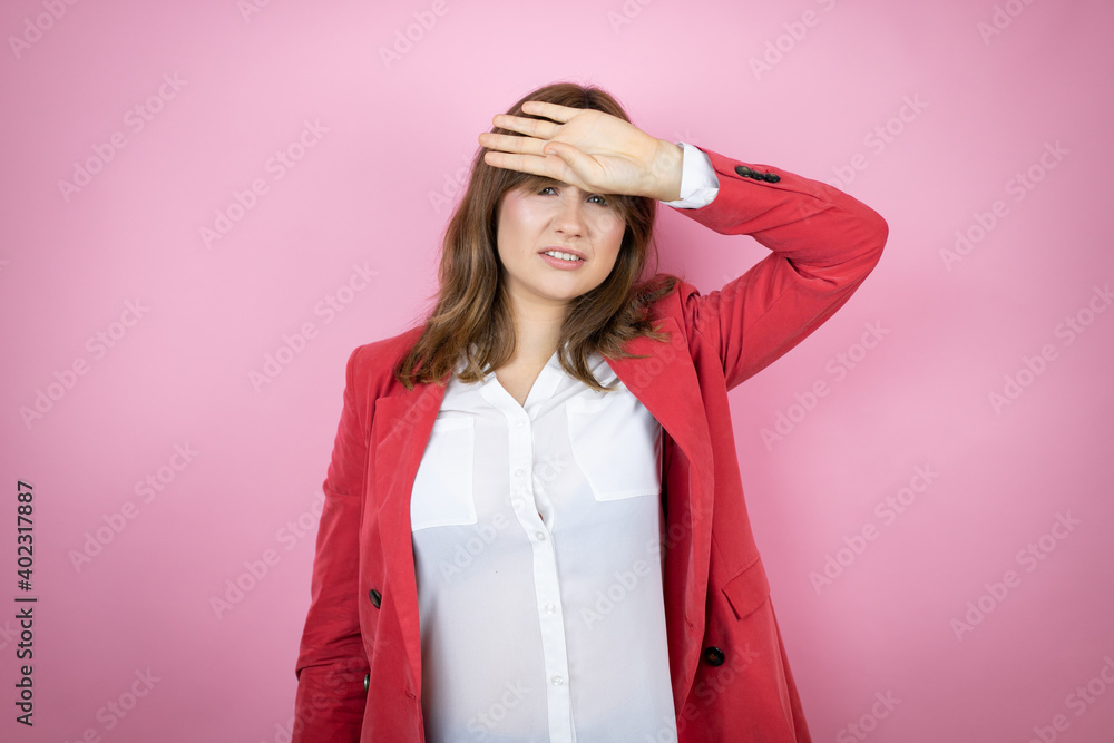 Young business woman over isolated pink background Touching forehead for illness and fever, flu and cold, virus sick Young business woman over isolated pink background Touching forehead for illness and fever, flu and cold, virus sick
