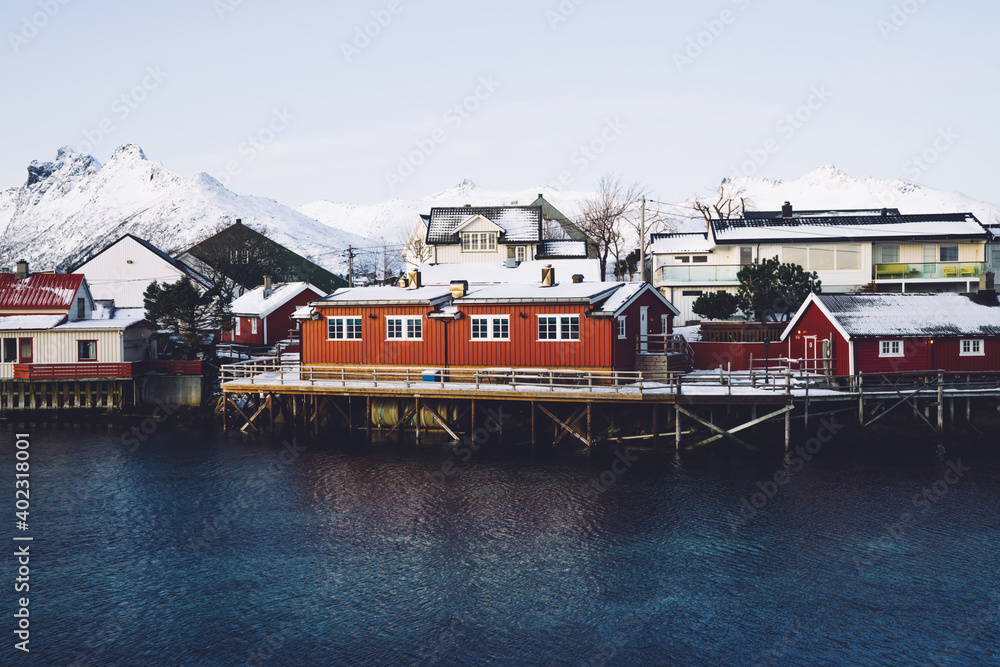 Small houses on shore blue fjord