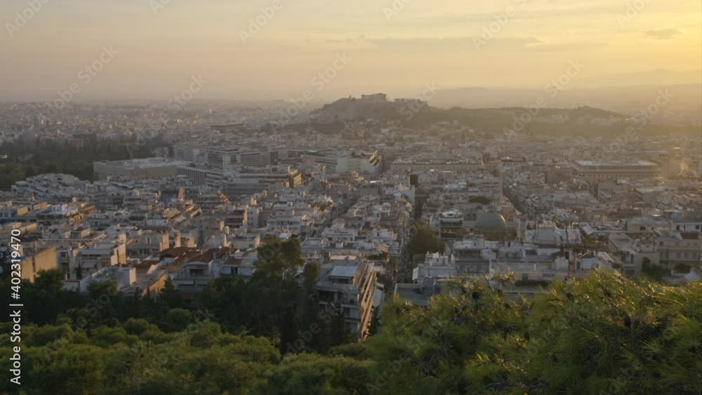 High angle view of the Acropolis, Parthenon, and forest park in Athens, Greece at sunset. High angle view of the Acropolis, Parthenon, and forest park in Athens, Greece at sunset.