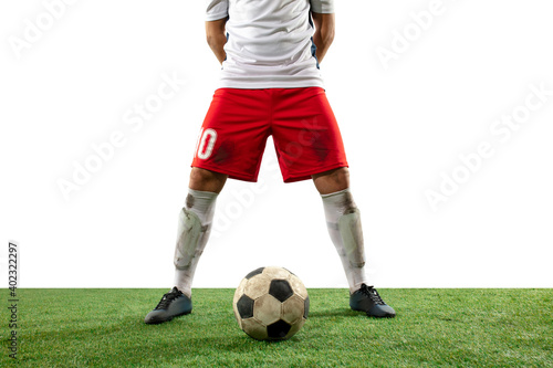 Leader. Close up legs of professional soccer, football player fighting for ball on field isolated on white background. Concept of action, motion, high tensioned emotion during game. Cropped image. © master1305