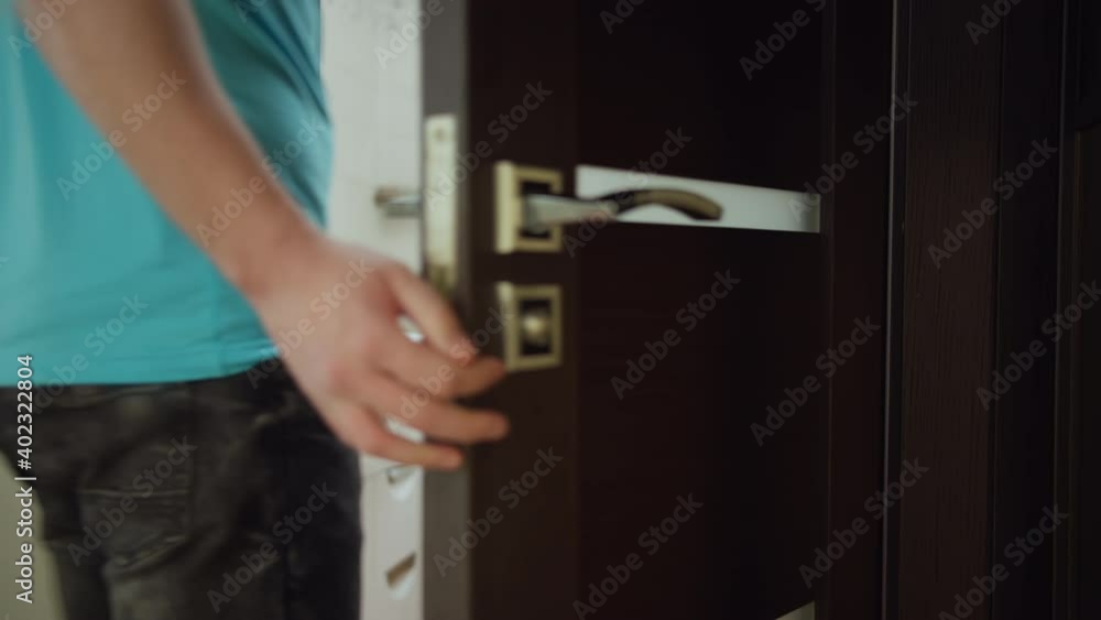 A man enters the bath room, wash his hands A man enters the bath room, wash his hands