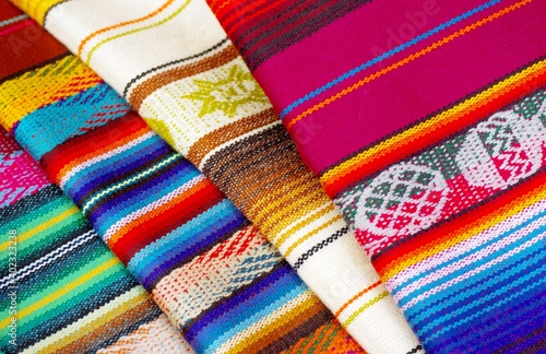 Colorful market with beautiful and unique handicraft fabric patterns available in Ecuador