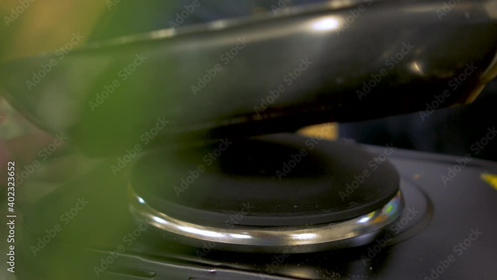Small size juicy meat balls frying in a steel pan, chief checks both sides, handheld close up shot Small size juicy meat balls frying in a steel pan, chief checks both sides, handheld close up shot