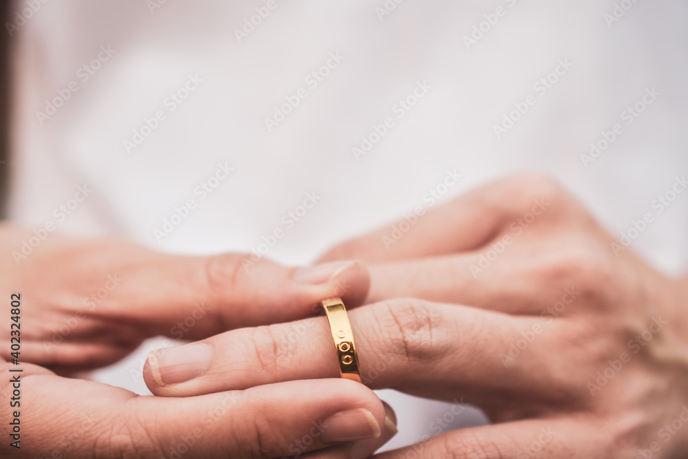 Fototapeta premium Close up hand holding wedding ring concept Couple love in Valentine
