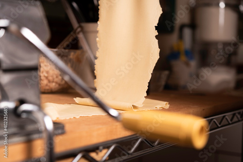 Making Pasta and Tortellini at Home on Wooden Rack and Chrome Pasta Maker