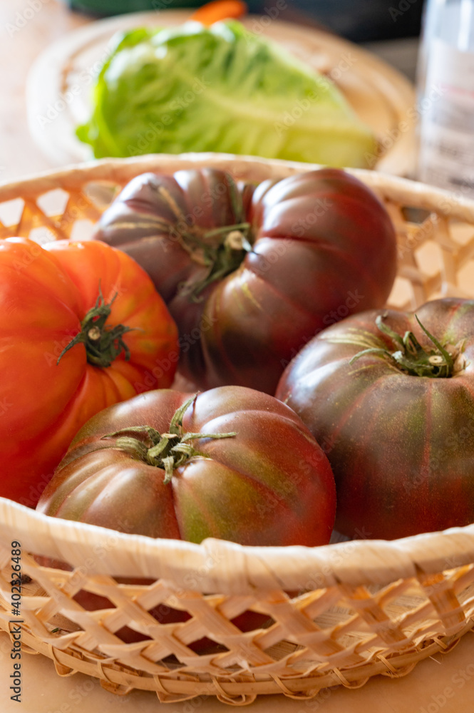 New harvest of big raddish-purple heirloom tomatoes Black Crimea