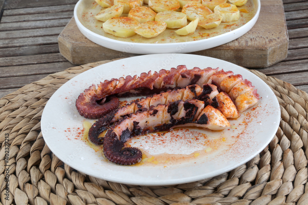 fresh octopus with potatoes in red paprika as diet food fresh octopus with potatoes in red paprika as diet food