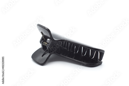 Closeup of black hairclip on white background